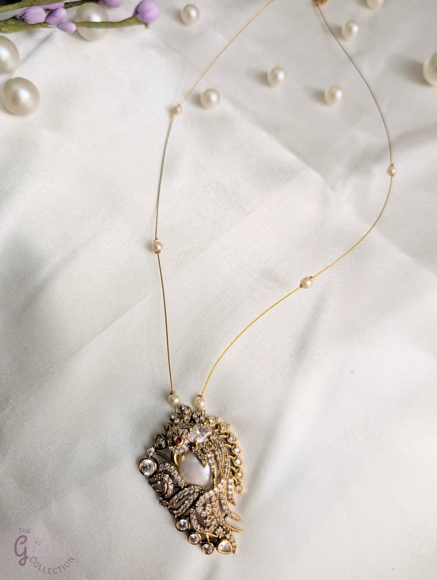 Pearl and CZ pendant on invisible chain — elegant floating necklace for special occasions and everyday sophistication.