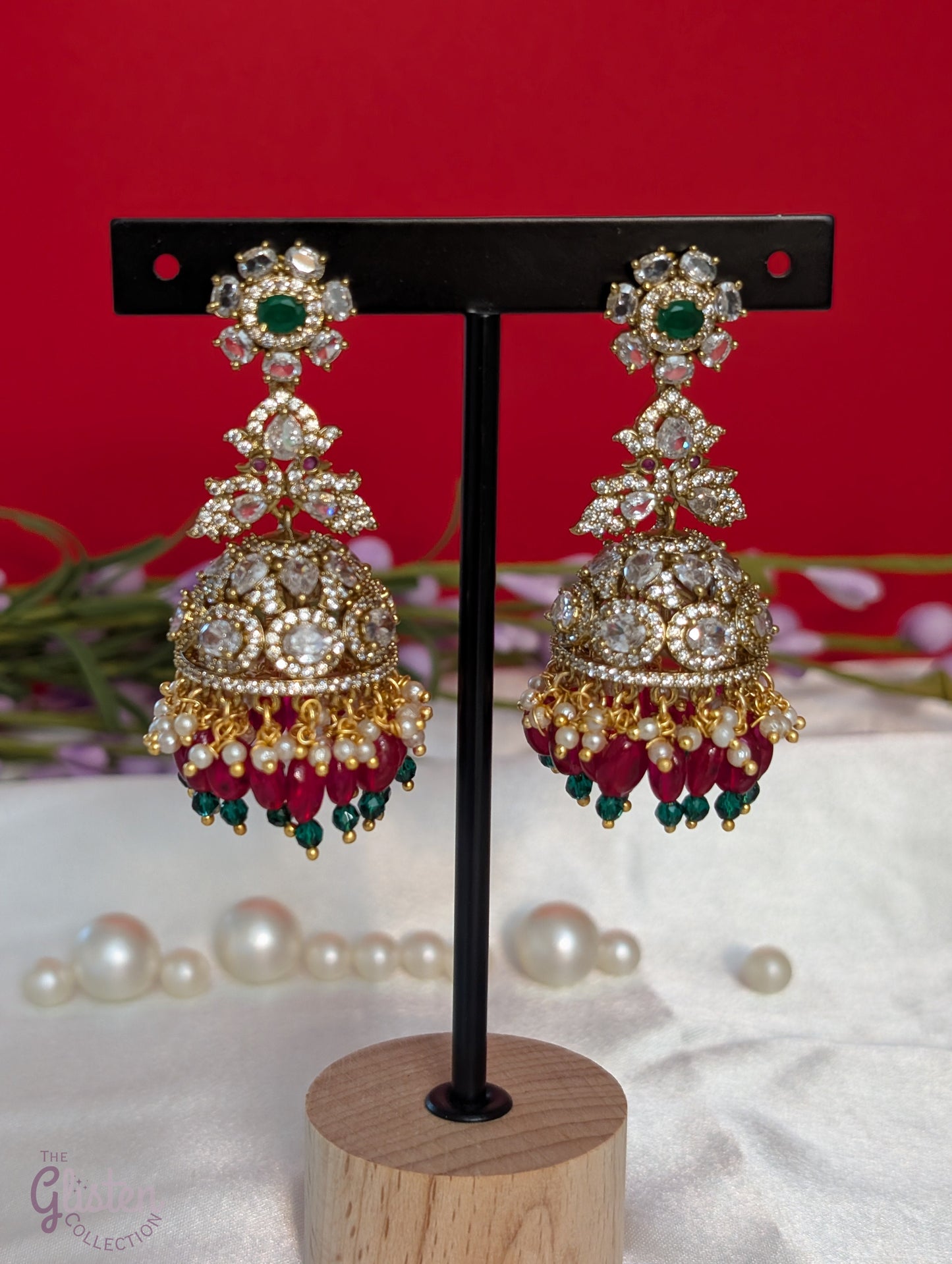 Elegant Rainbow Dangle Jhumka earrings with white, red, and green beads, accented with green stone — ideal for Indian traditional attire and grand occasions.