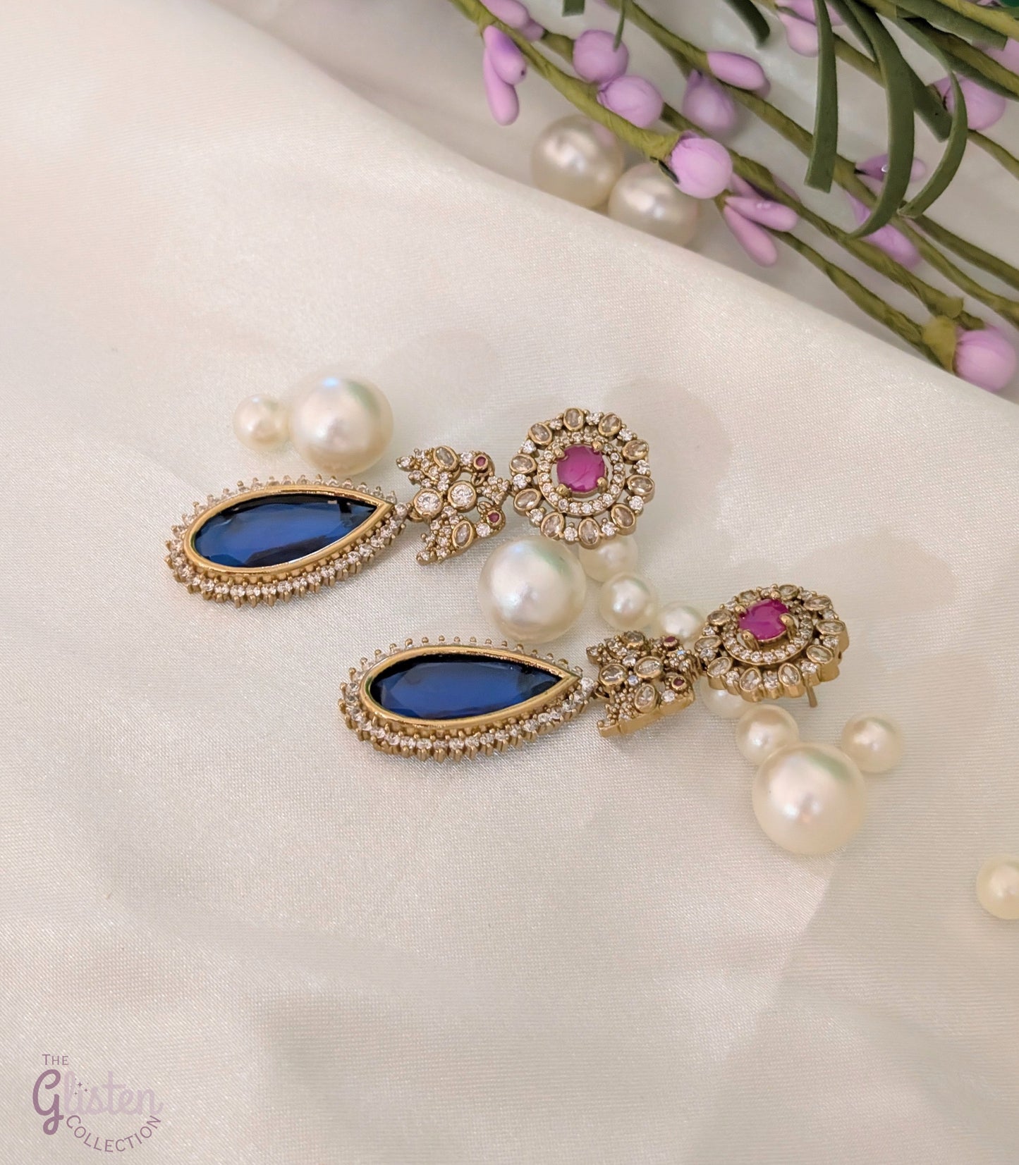 Blush & Blue Drop earrings with blue tear-drop stone, pink round stone, and CZ detailing — elegant for cocktail parties and celebrations.