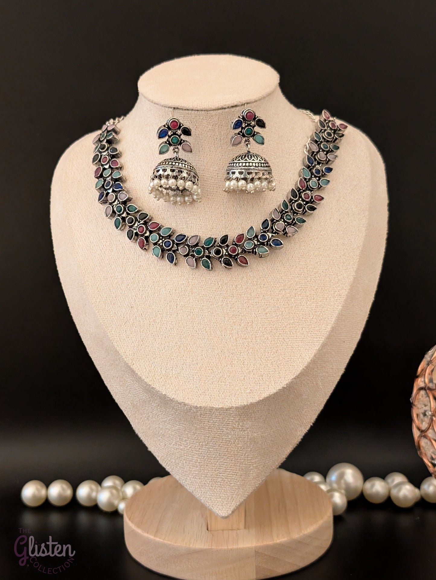 Leaf design oxidized German silver necklace set with colorful teardrop stones and matching pearl jhumkas — perfect for simple ethnic wear or festive style.