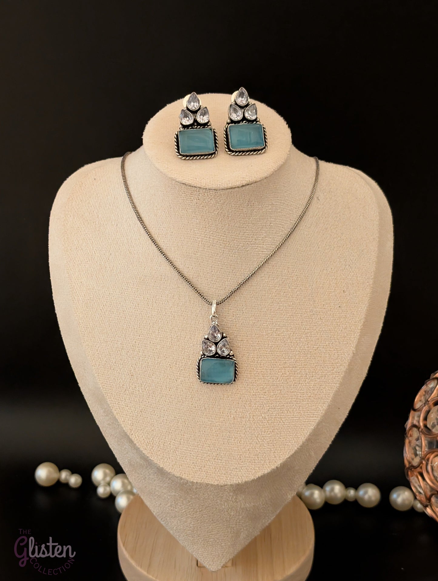 Oxidized silver pendant set with rectangular green stones, twisted rope frame, and American Diamonds — perfect for festive, ethnic, or everyday looks.