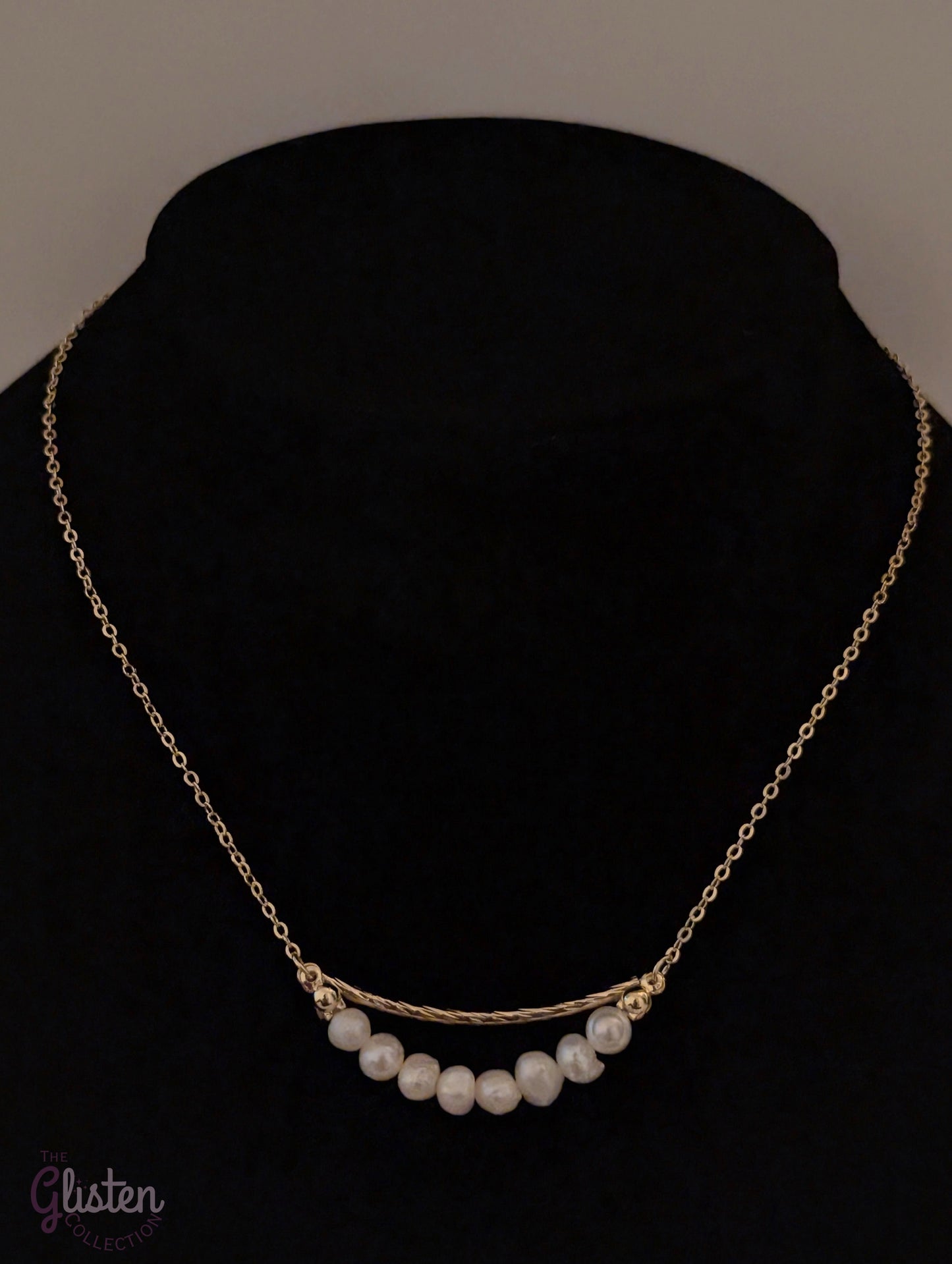 Gold-plated necklace with geometric ring and irregular freshwater pearl drop, a trendy fashion piece with organic elegance.