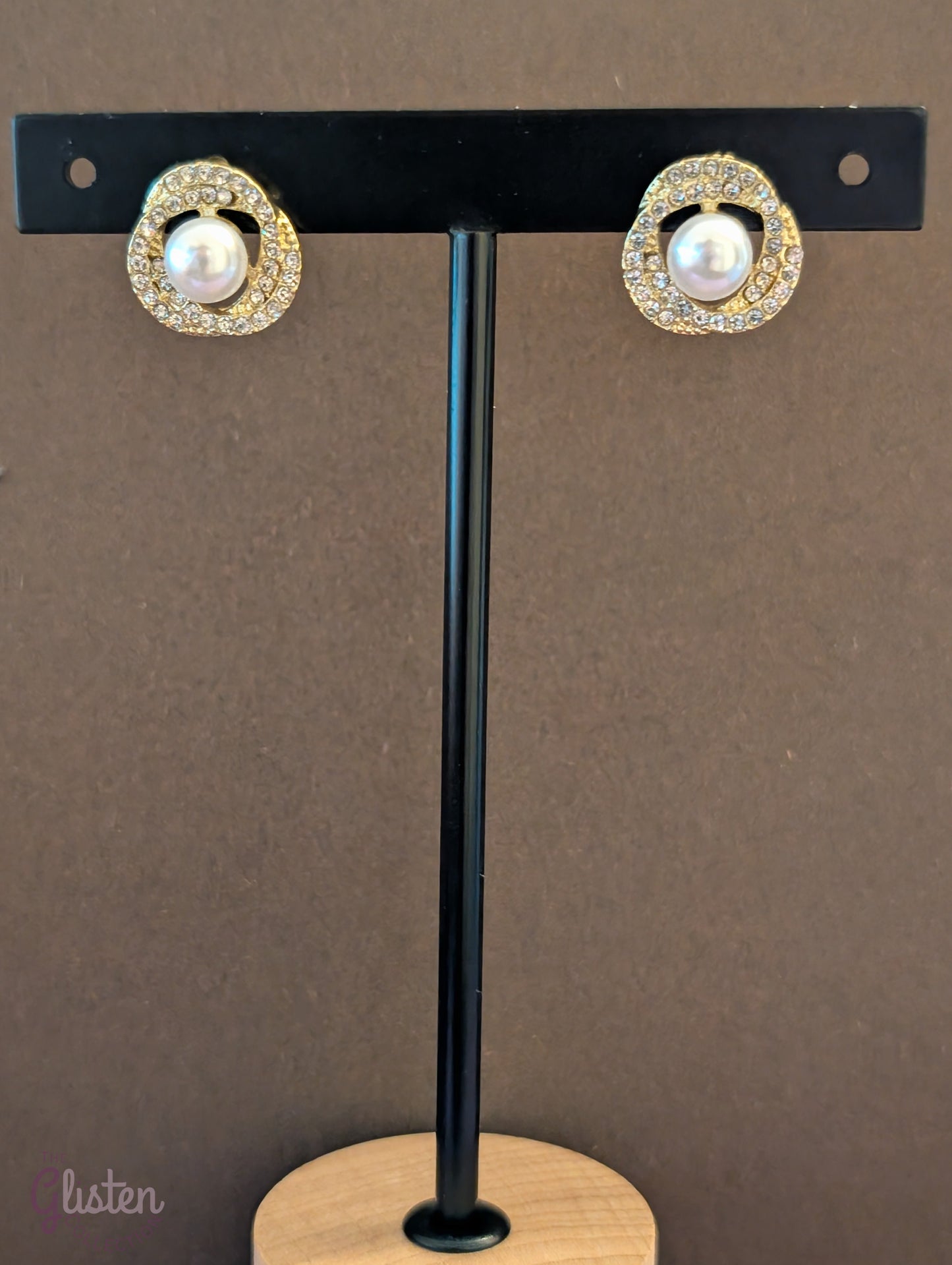 Titanium steel gold-plated stud earrings with artificial pearls and zircon accents, perfect for office wear and daily elegance.