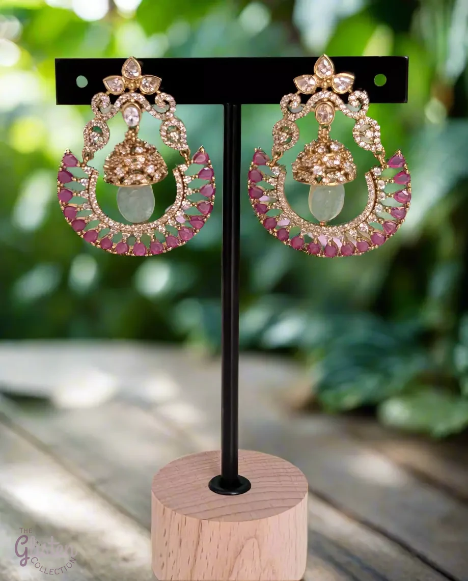 Blush Moon Chandbalis with dome-shaped top, crescent design, and vibrant pink stones — perfect for adding elegance to special occasions.