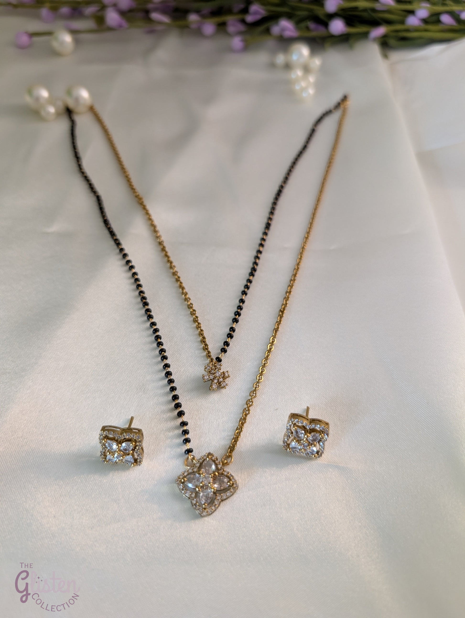 Layered black bead necklace set with Moissanite floral designs and simple matching earrings — perfect for daily wear and traditional occasions.