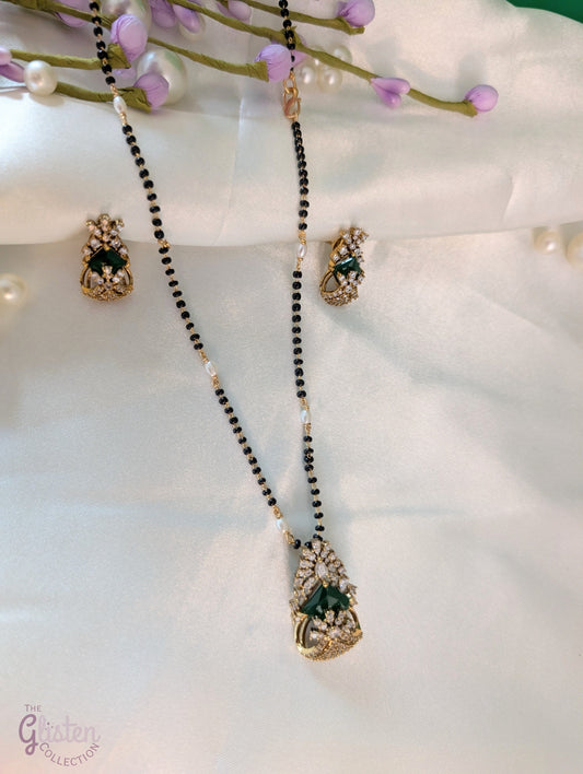 Bead-linked necklace with central green stone and matching earrings — elegant jewellery for festive and everyday wear.