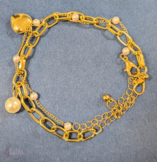 Set of two bracelets – one with heart charm and pearls, one with full artificial pearls, perfect for layering and daily wear.
