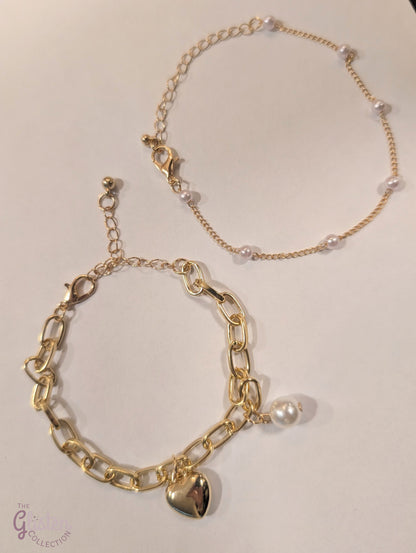 Set of two bracelets – one with heart charm and pearls, one with full artificial pearls, perfect for layering and daily wear.