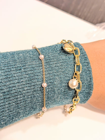 Set of two bracelets – one with heart charm and pearls, one with full artificial pearls, perfect for layering and daily wear.