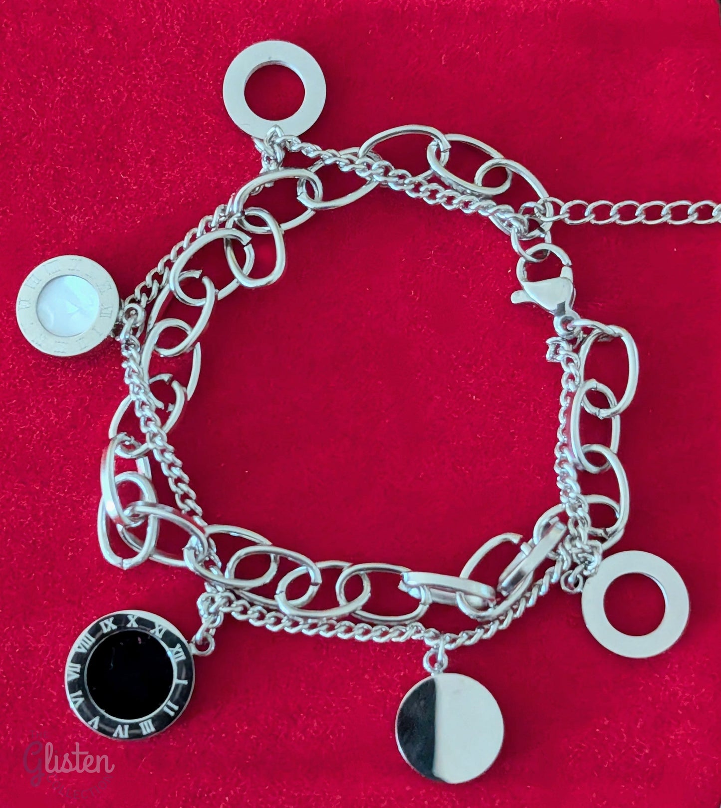 Roman-inspired double-layer titanium steel bracelet with 18K gold plating, adding a stylish and modern touch to any outfit.