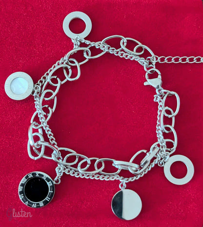 Roman-inspired double-layer titanium steel bracelet with 18K gold plating, adding a stylish and modern touch to any outfit.