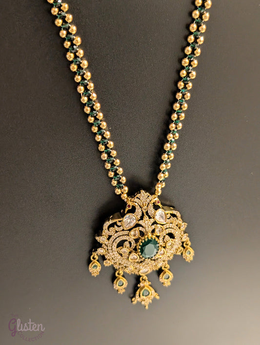 Green color chain necklace with ornate CZ pendant and dangling green stones — elegant festive jewellery for all ages, perfect for weddings and celebrations.