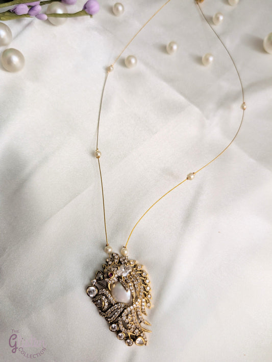 Pearl and CZ pendant on invisible chain — elegant floating necklace for special occasions and everyday sophistication.