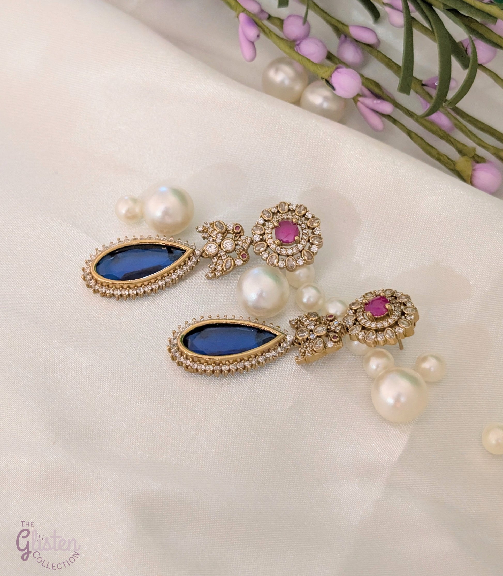Blush & Blue Drop earrings with blue tear-drop stone, pink round stone, and CZ detailing — elegant for cocktail parties and celebrations.