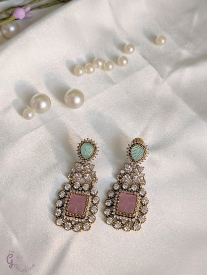 Rose Dew Drops earrings with pink square base, green tear-drop top, and Moissanite stones — ideal for modern or traditional occasions.