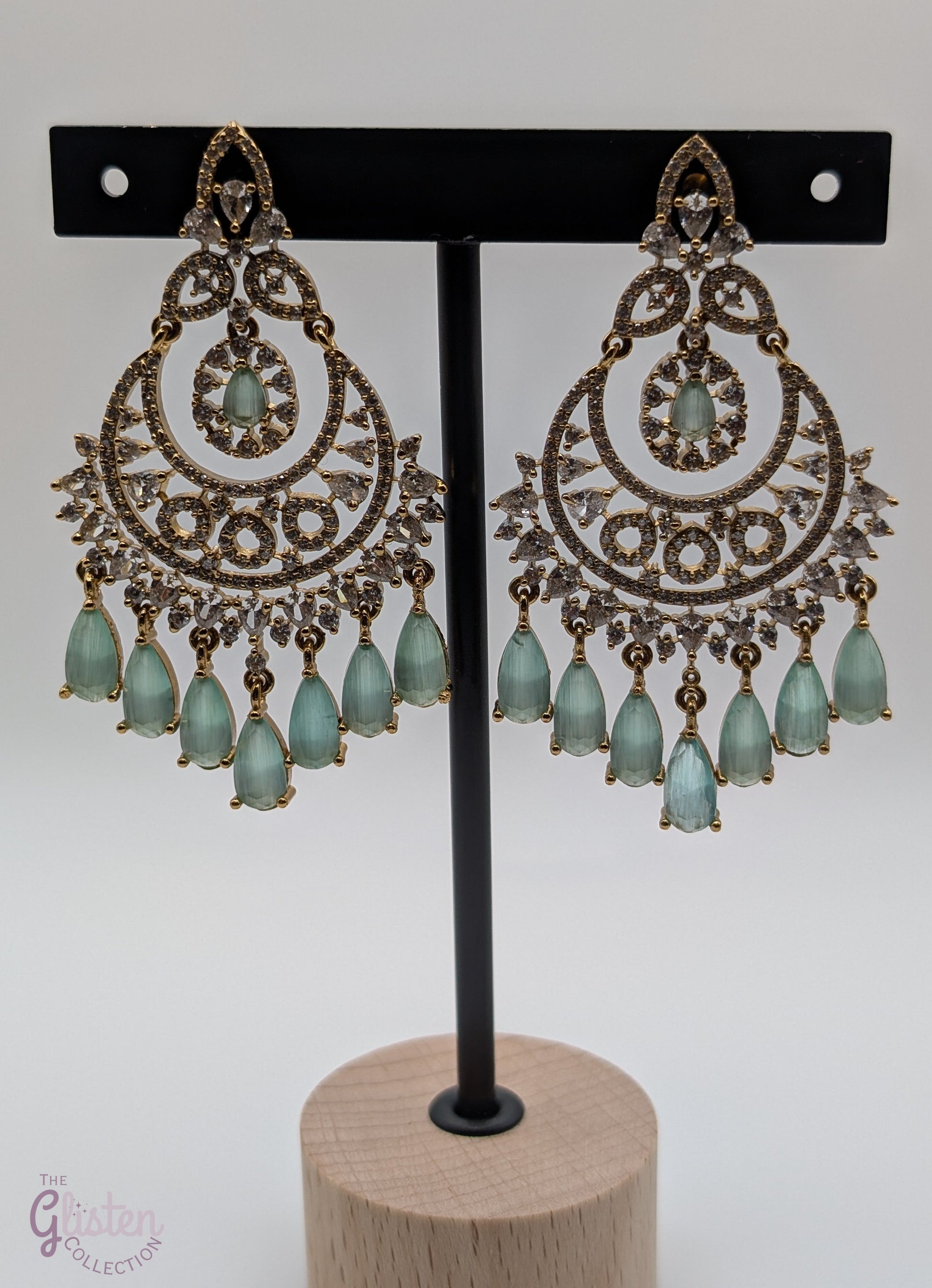 Mint Glow Chandbalis with light green stones, tear-drop dangles, CZ detailing, and classic gold-tone setting — must-have, best-selling earrings for any occasion, popular and loved by many.