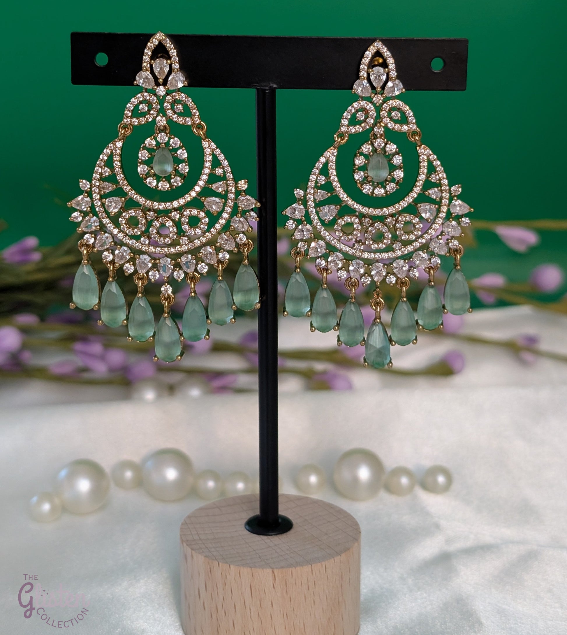 Mint Glow Chandbalis with light green stones, tear-drop dangles, CZ detailing, and classic gold-tone setting — must-have, best-selling earrings for any occasion, popular and loved by many.