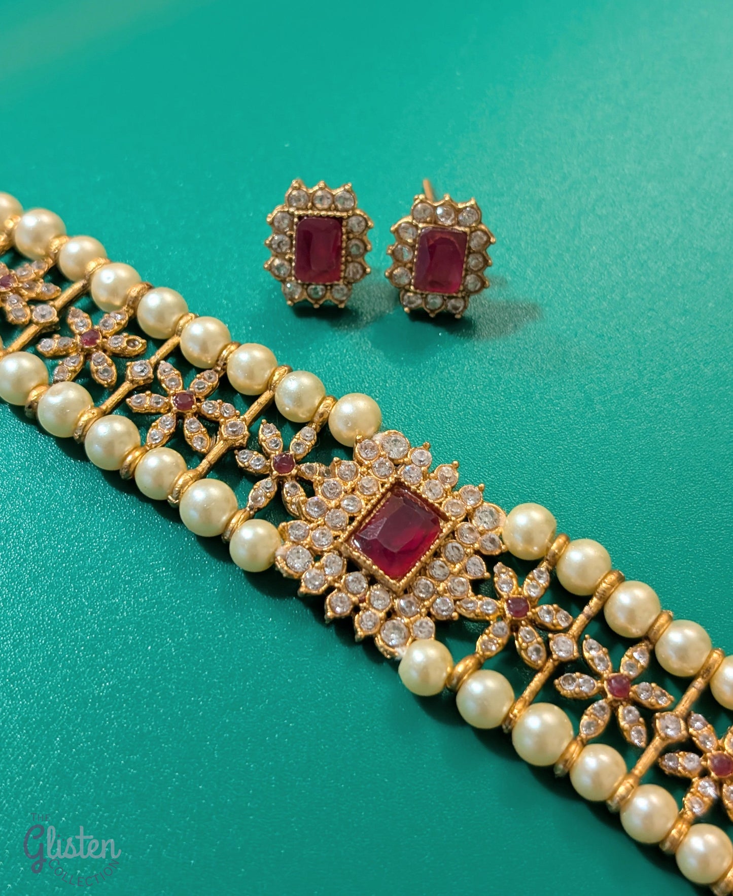 Matte gold-plated Temple Pearl choker necklace set with floral design and matching stud earrings, perfect for traditional occasions.