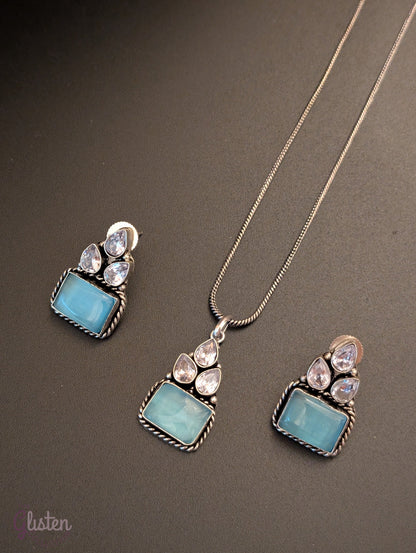 Oxidized silver pendant set with rectangular green stones, twisted rope frame, and American Diamonds — perfect for festive, ethnic, or everyday looks.