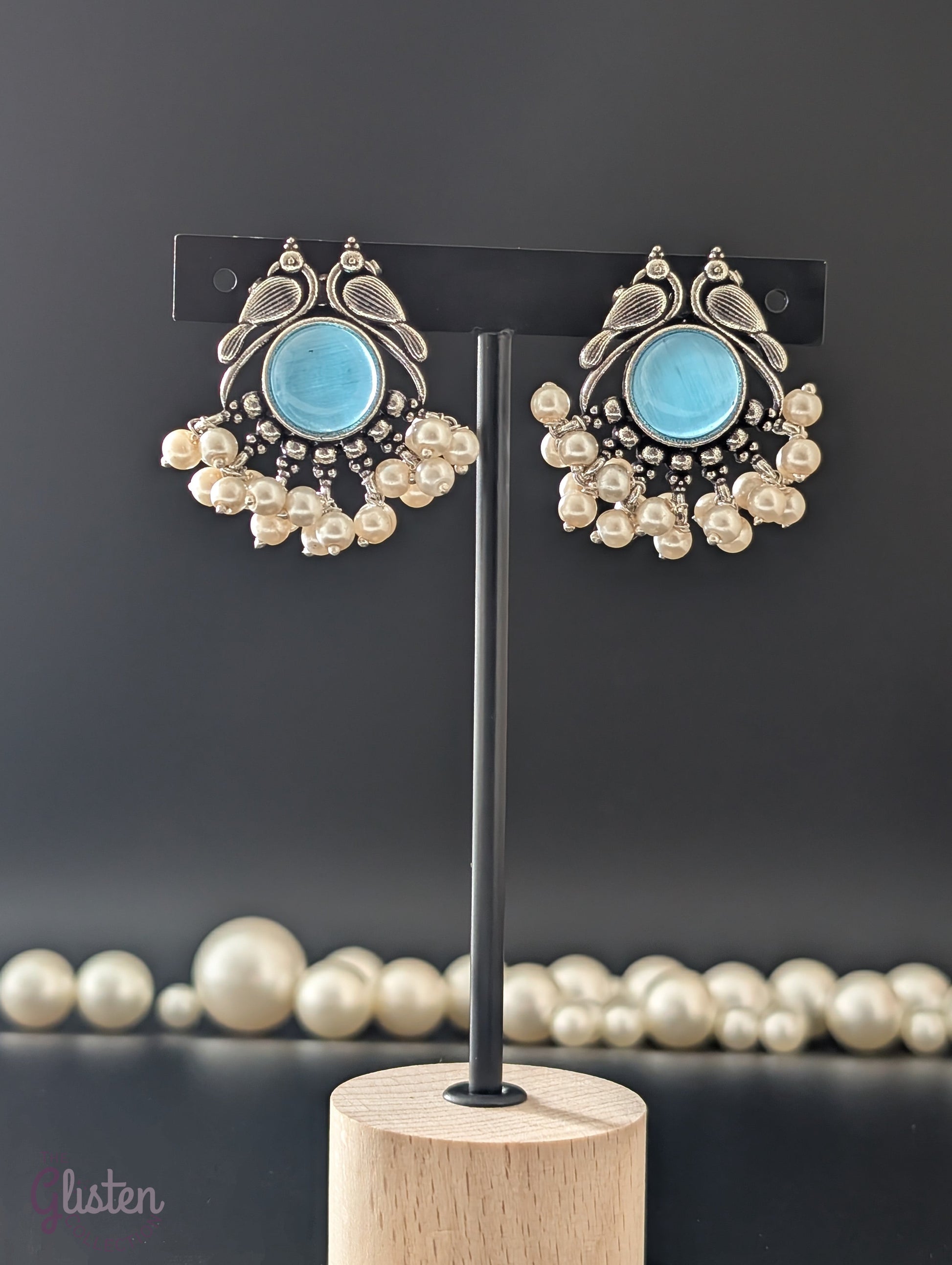 Oxidized peacock motif earrings with central stones and pearl drops — elegant vintage-style earrings for ethnic wear, festive looks, and graceful charm.