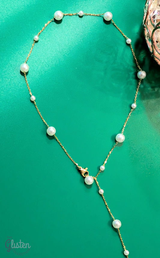 Elegant geometric tassel necklace made of titanium steel with artificial pearls, perfect for adding sophistication to any look.