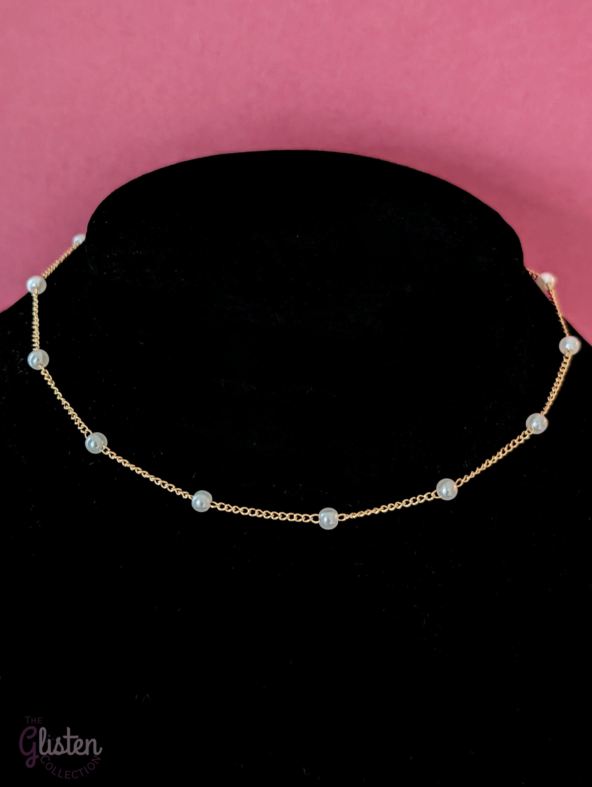 Three-layer gold necklace set with butterfly charm, pearl line, and single pearl pendant; can be worn individually or layered for a stylish statement.