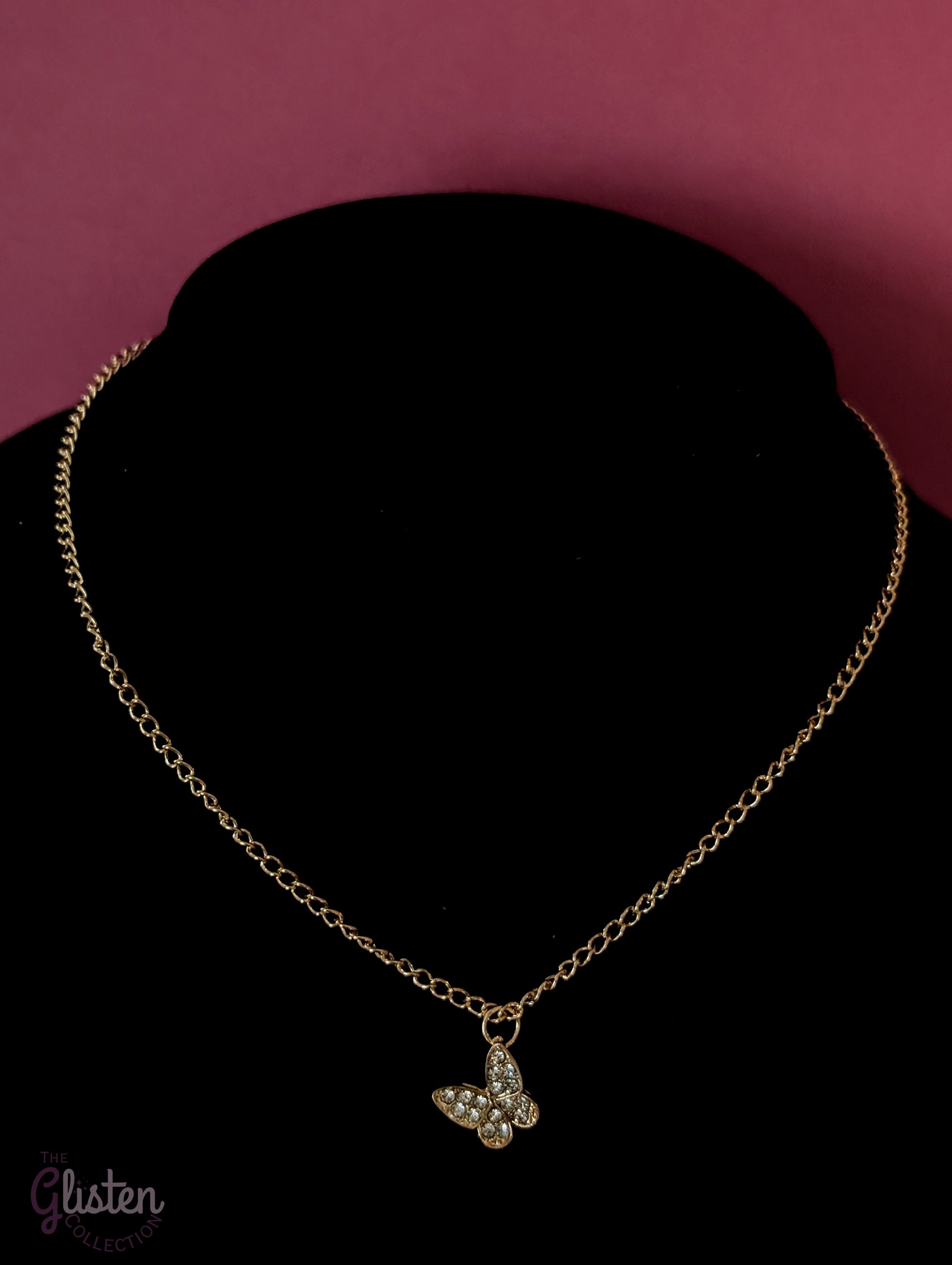 Three-layer gold necklace set with butterfly charm, pearl line, and single pearl pendant; can be worn individually or layered for a stylish statement.