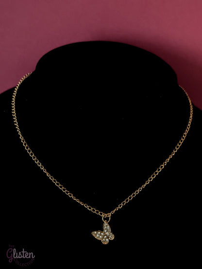 Three-layer gold necklace set with butterfly charm, pearl line, and single pearl pendant; can be worn individually or layered for a stylish statement.