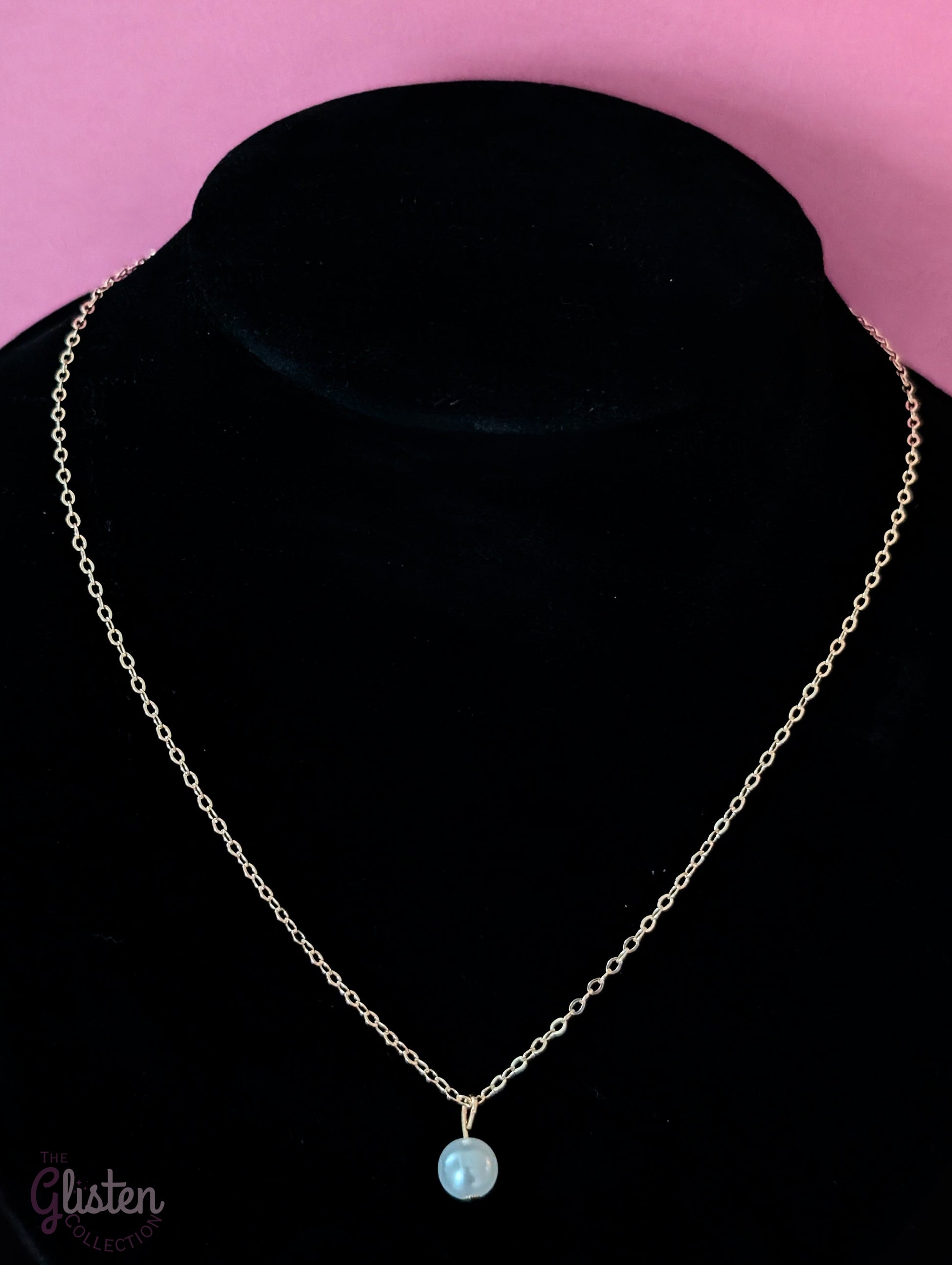 Three-layer gold necklace set with butterfly charm, pearl line, and single pearl pendant; can be worn individually or layered for a stylish statement.