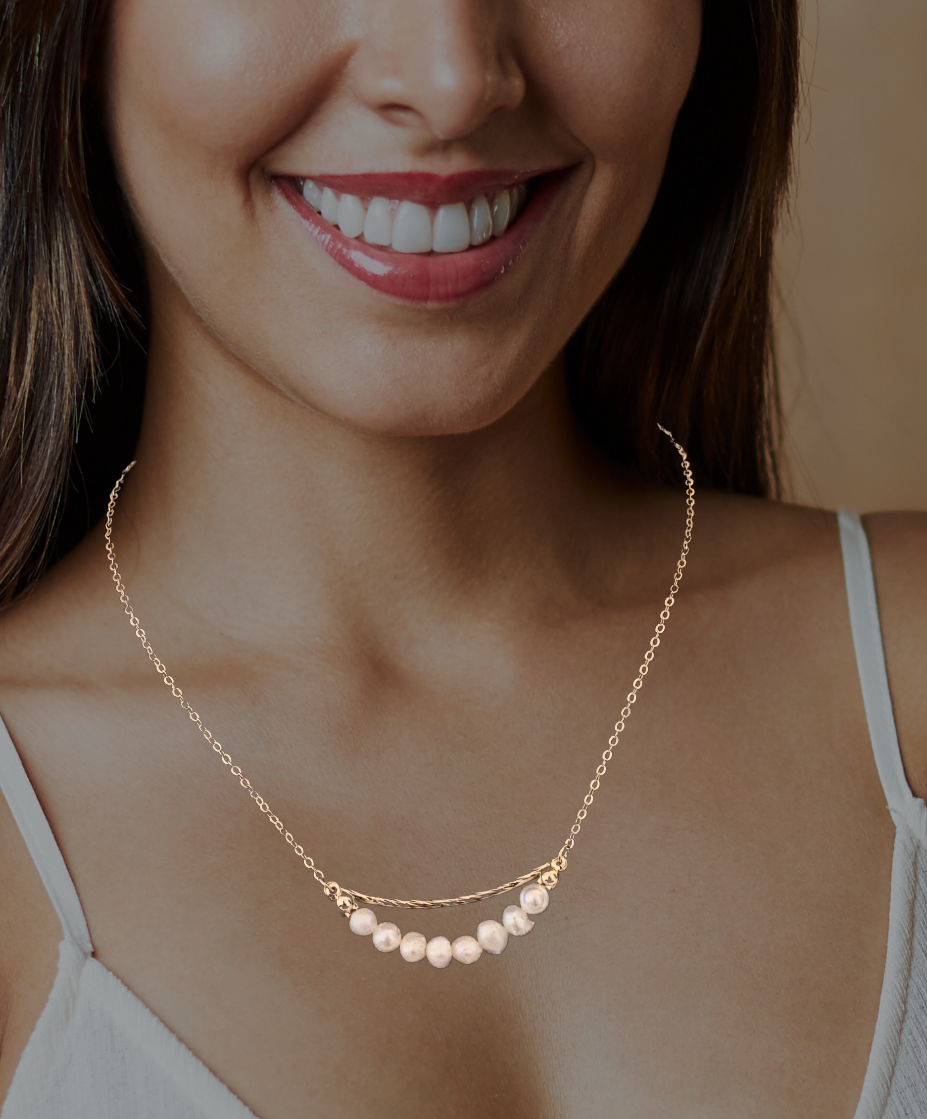 Gold-plated necklace with geometric ring and irregular freshwater pearl drop, a trendy fashion piece with organic elegance.
