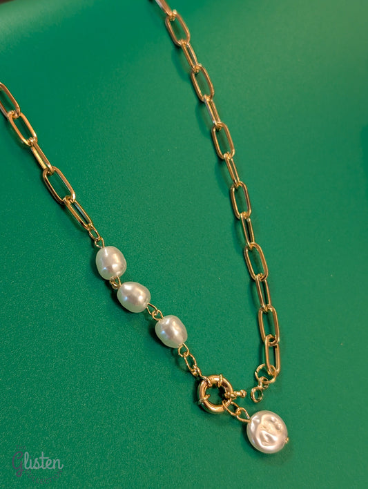 Minimalist round imitation pearl pendant necklace with unique bottom-opening mechanism.