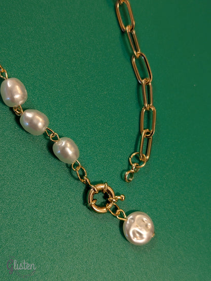 Minimalist round imitation pearl pendant necklace with unique bottom-opening mechanism.