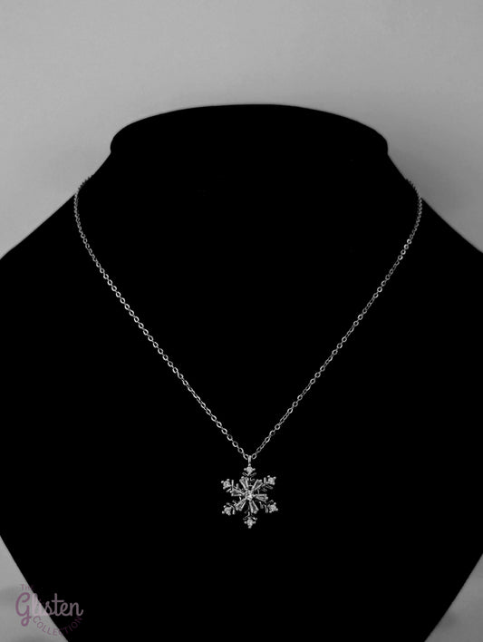 Rotatable snowflake pendant necklace with titanium steel plating and artificial gemstones, adding a dynamic and elegant touch to your outfit.