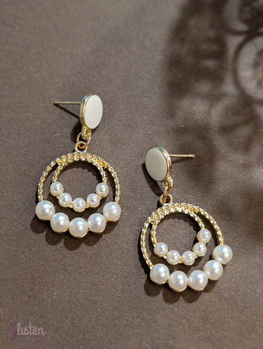 Elegant drop earrings with rhinestone top and pearl drop, perfect for adding sophistication to any look.