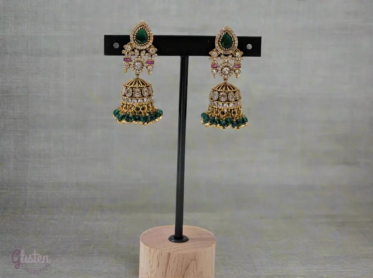Emerald Flow Jhumkas with green stones, delicate accents, and green bead dangles — perfect for simple yet festive looks at parties and special occasions.