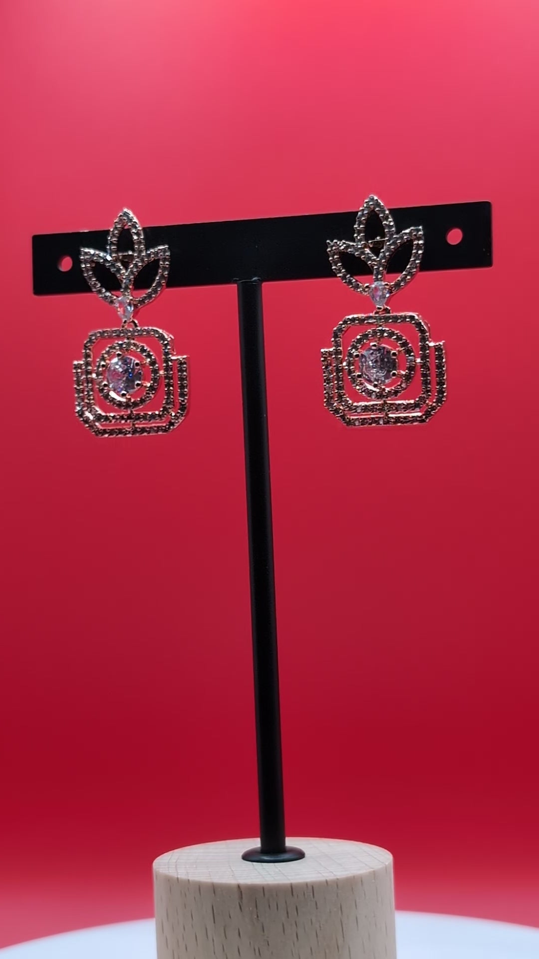 Rose gold-plated earrings with American diamond stones in leaf and teardrop design — perfect blend of traditional and contemporary elegance.
