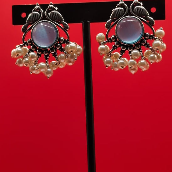 Oxidized peacock motif earrings with central stones and pearl drops — elegant vintage-style earrings for ethnic wear, festive looks, and graceful charm.