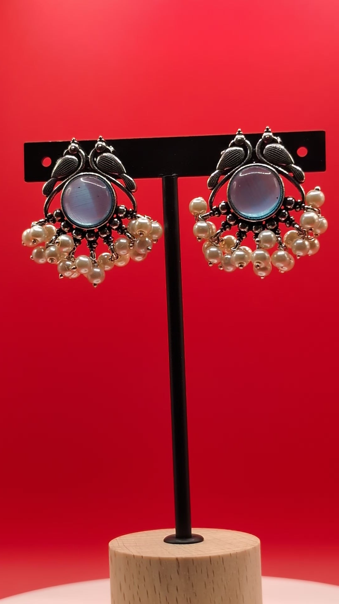 Oxidized peacock motif earrings with central stones and pearl drops — elegant vintage-style earrings for ethnic wear, festive looks, and graceful charm.