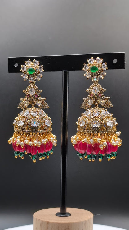 Elegant Rainbow Dangle Jhumka earrings with white, red, and green beads, accented with green stone — ideal for Indian traditional attire and grand occasions.