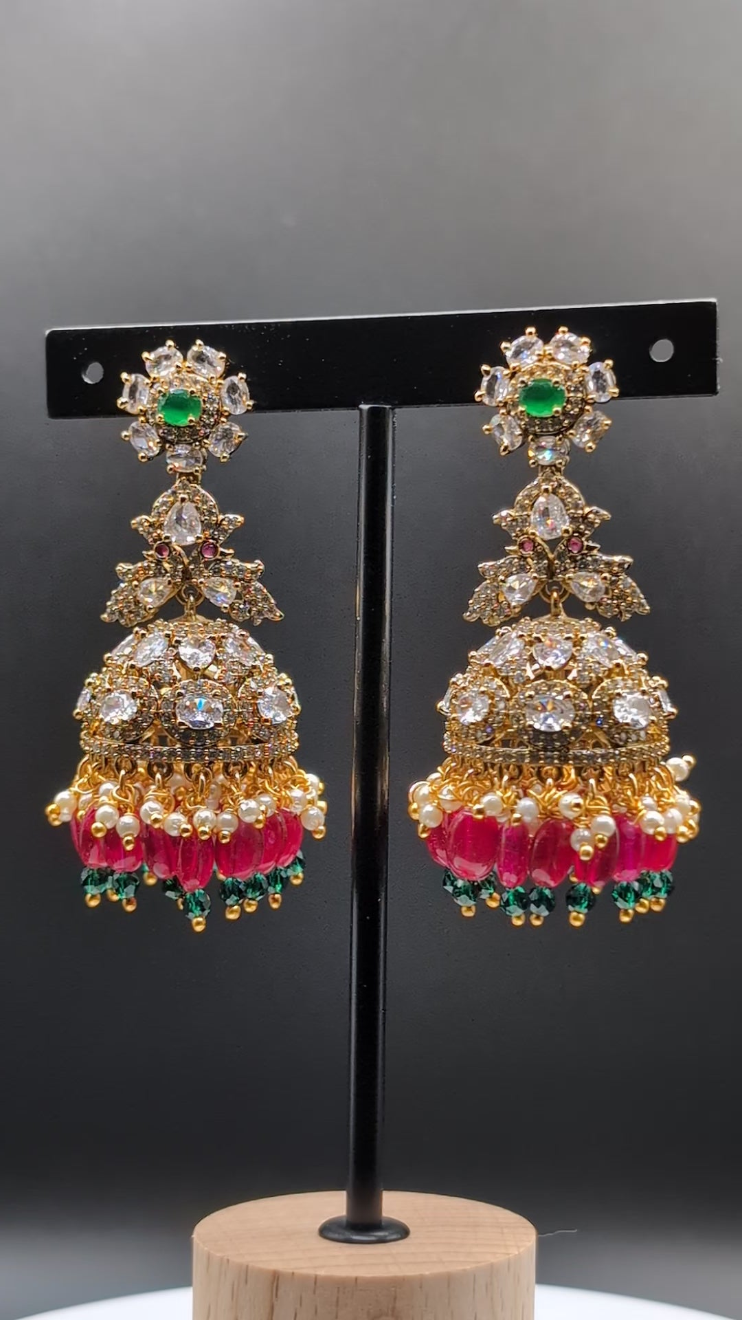 Elegant Rainbow Dangle Jhumka earrings with white, red, and green beads, accented with green stone — ideal for Indian traditional attire and grand occasions.