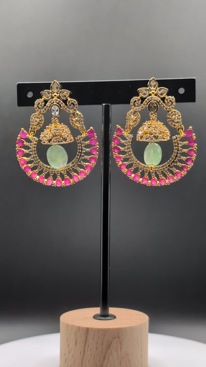 Blush Moon Chandbalis with dome-shaped top, crescent design, and vibrant pink stones — perfect for adding elegance to special occasions.