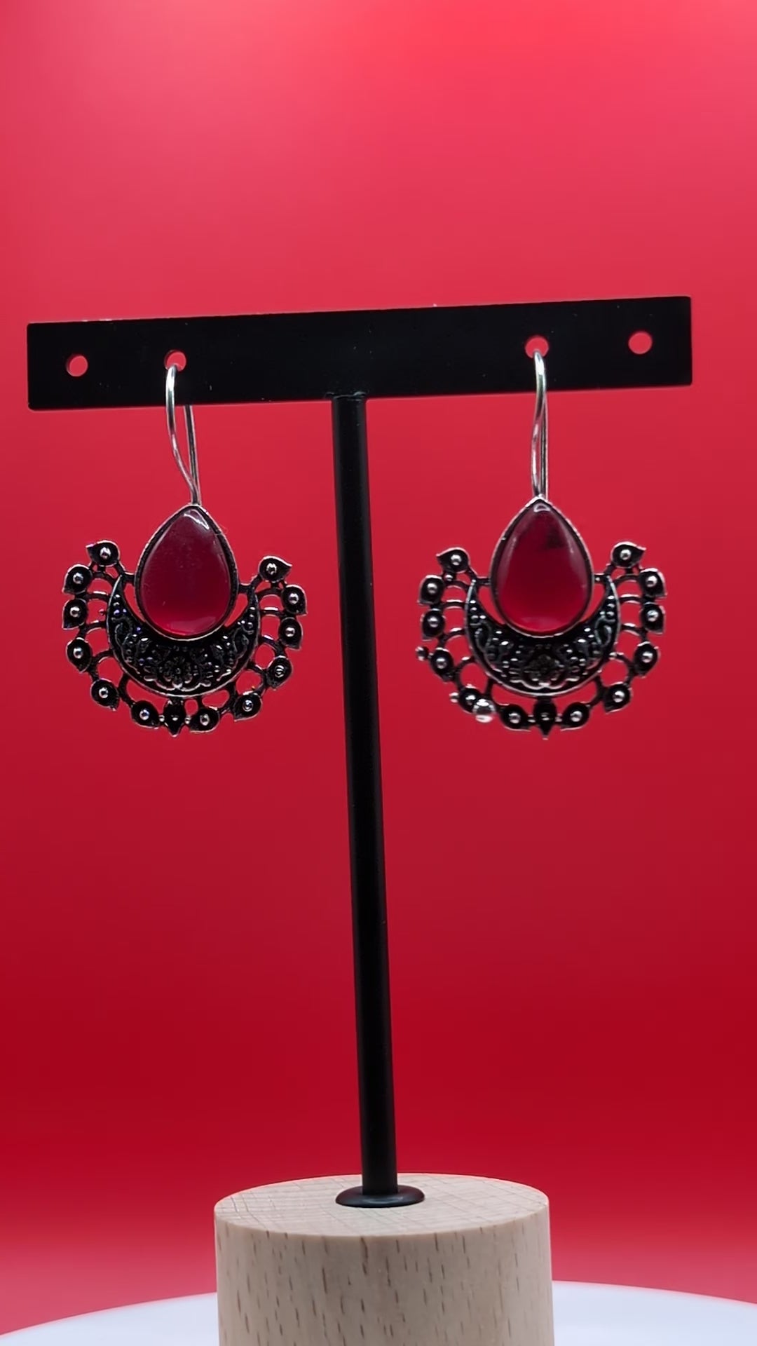 Boho-style oxidized earrings with a single ocean blue teardrop stone from The Glisten Collection.