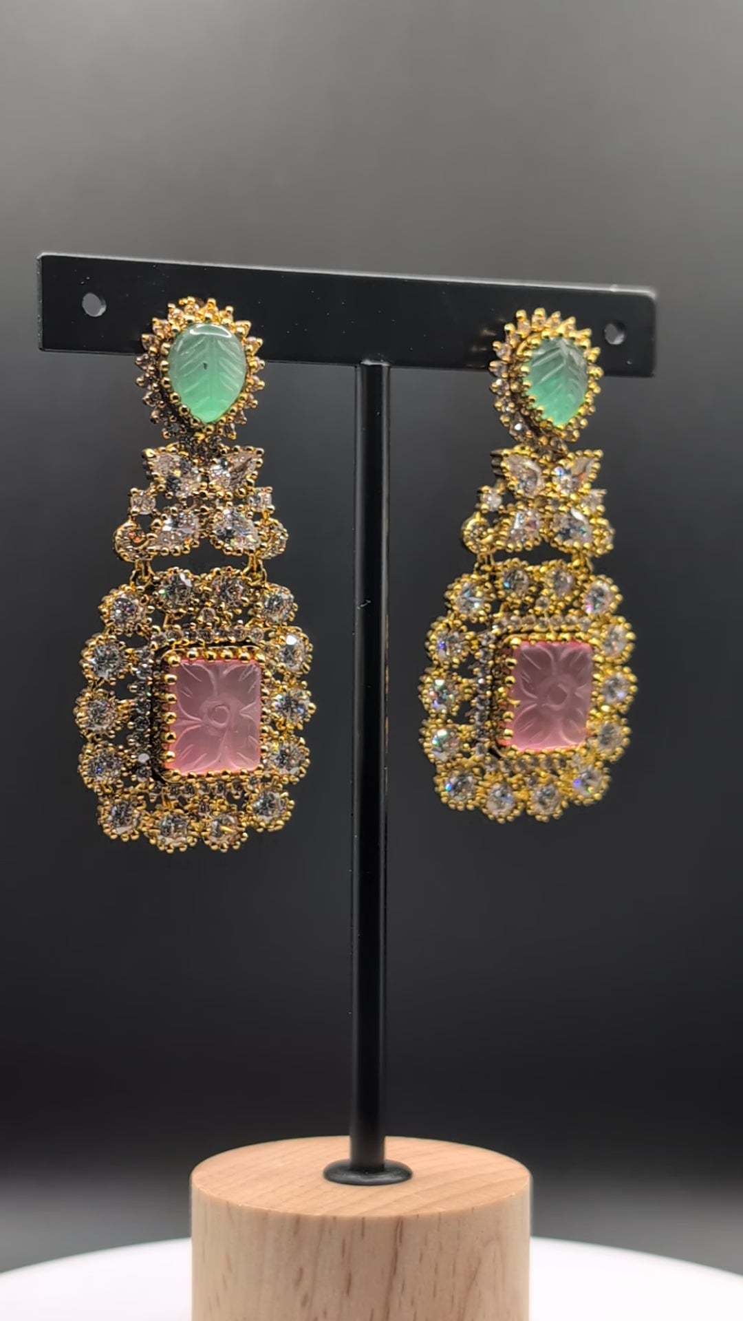 Rose Dew Drops earrings with pink square base, green tear-drop top, and Moissanite stones — ideal for modern or traditional occasions.