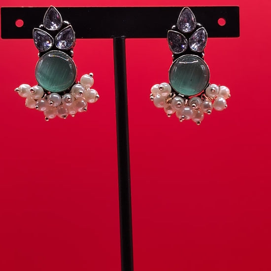 Oxidized German silver earrings with Monalisa stones, American Diamonds (AD), and pearl drops, perfect for traditional wear and special occasions.