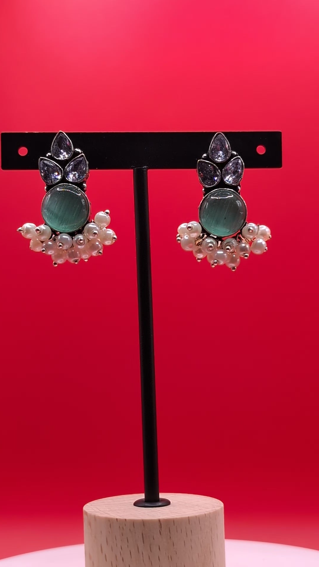 Oxidized German silver earrings with Monalisa stones, American Diamonds (AD), and pearl drops, perfect for traditional wear and special occasions.